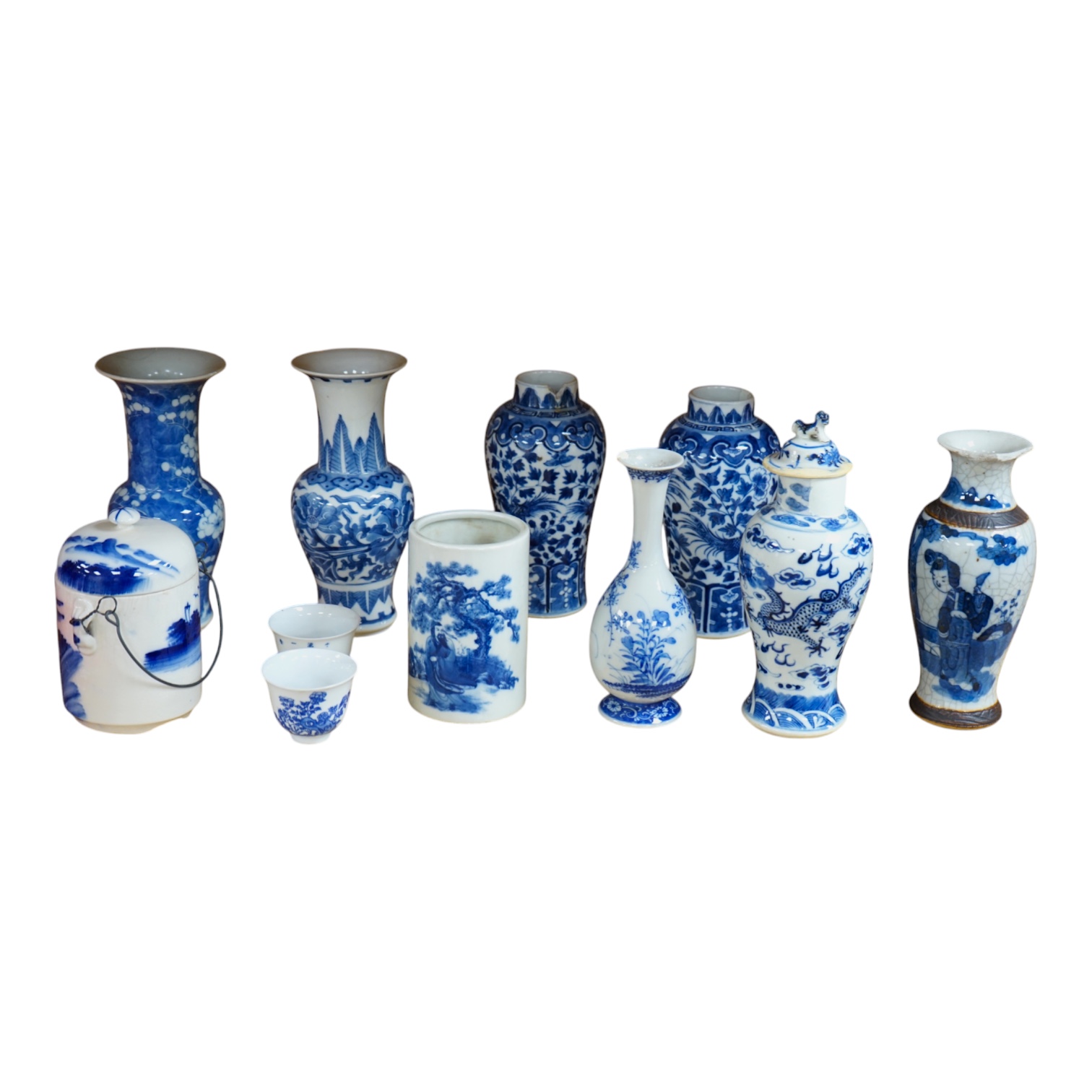 A collection of 19th and 20th century Chinese blue and white vases and tea bowls, largest 21cm high. Condition - varies, mostly poor